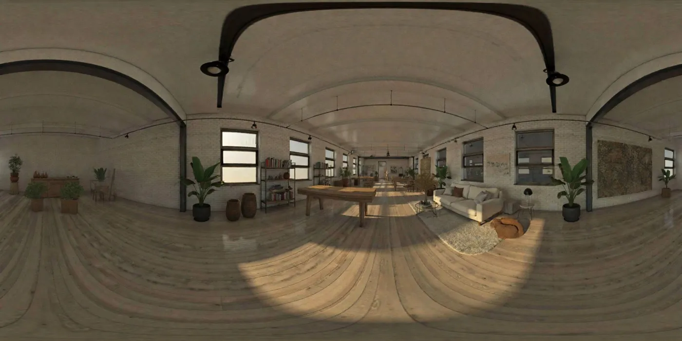 An equirectangular panorama of a loft with brick walls, tall windows, a worktable, a sofa and plants